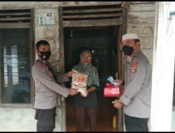 Kapolsek Lubuk Besar Membagikan 100 Paket Batuan Kepada Warga Kurang Mampu